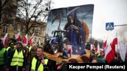 Farmers rally outside Polish Prime Minister Donald Tusk's office in Warsaw against the European Union's Green Deal and imports of Ukrainian agricultural products on March 6.
