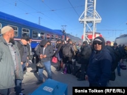 Scores of oil workers arrived in the Kazakh capital, Astana, from Zhanaozen on April 10.