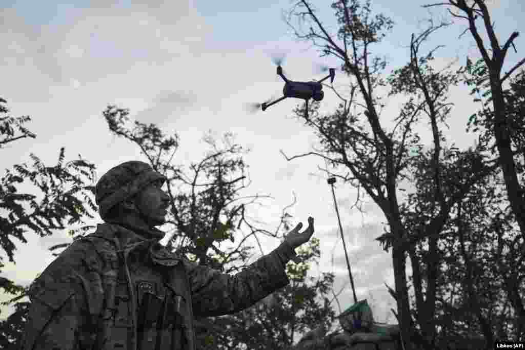 A Ukrainian soldier launches a drone from a position in the Donetsk region on September 4. A spokesman for Ukraine's 46th Air Assault Brigade told the BBC on September 2 that "no one has yet managed to go beyond the first line" of the Russian defense. 