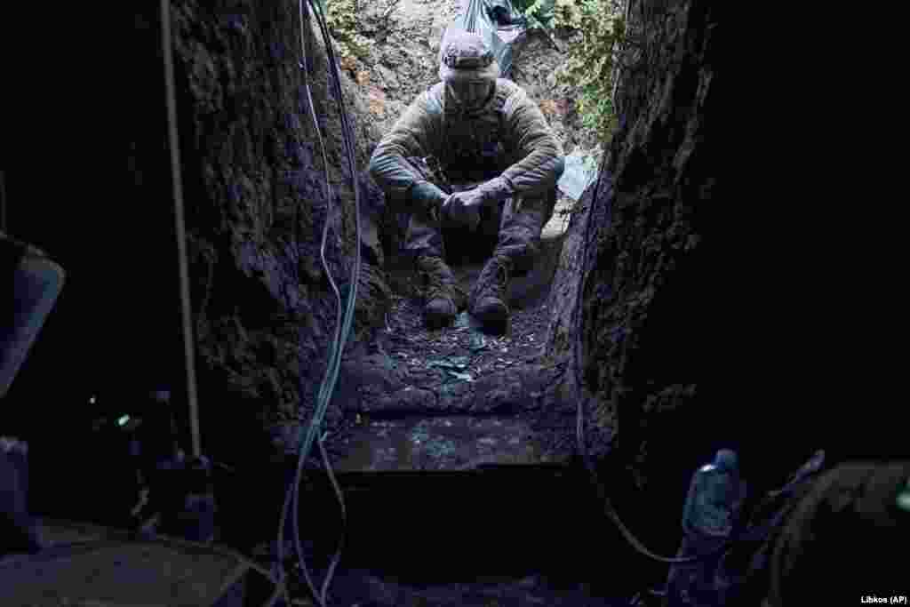 A Ukrainian soldier rests in a trench near Bakhmut on September 3. White House National Security Council spokesman John Kirby said on September 2 that “we’ve all seen the criticism by anonymous officials out there, which frankly is not helpful” to Ukraine’s battlefield effort." 