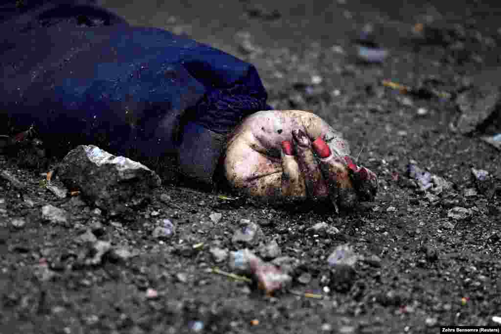 The brightly painted nails -- four were red and the fifth had a small purple heart bordered by silver varnish -- revealed the woman's identity. Iryna Filkina was a 52-year-old heating operator at a shopping mall when she was killed in Bucha, a town northwest of the Ukrainian capital, Kyiv.