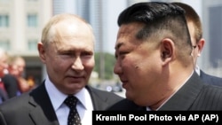 Президент России Владимир Путин и глава КНДР Ким Чен Ын 