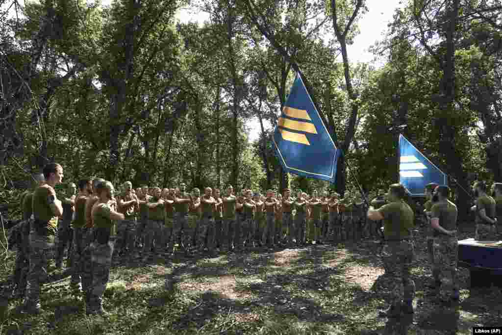 Soldiers of Ukraine's 3rd Separate Assault Brigade during a ceremony near Bakhmut on September 3. The news of Kyiv's battlefield gains comes after reports of Western unease at the slow pace of the Ukrainian advance, with some analysts saying the months-old Ukrainian counteroffensive has effectively “stalled” in the face of Russian defenses. 