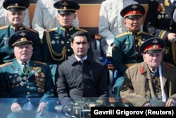 Turkmen President Serdar Berdymukhammedov (center) is seen in Moscow for the Victory Day parade on May 9.