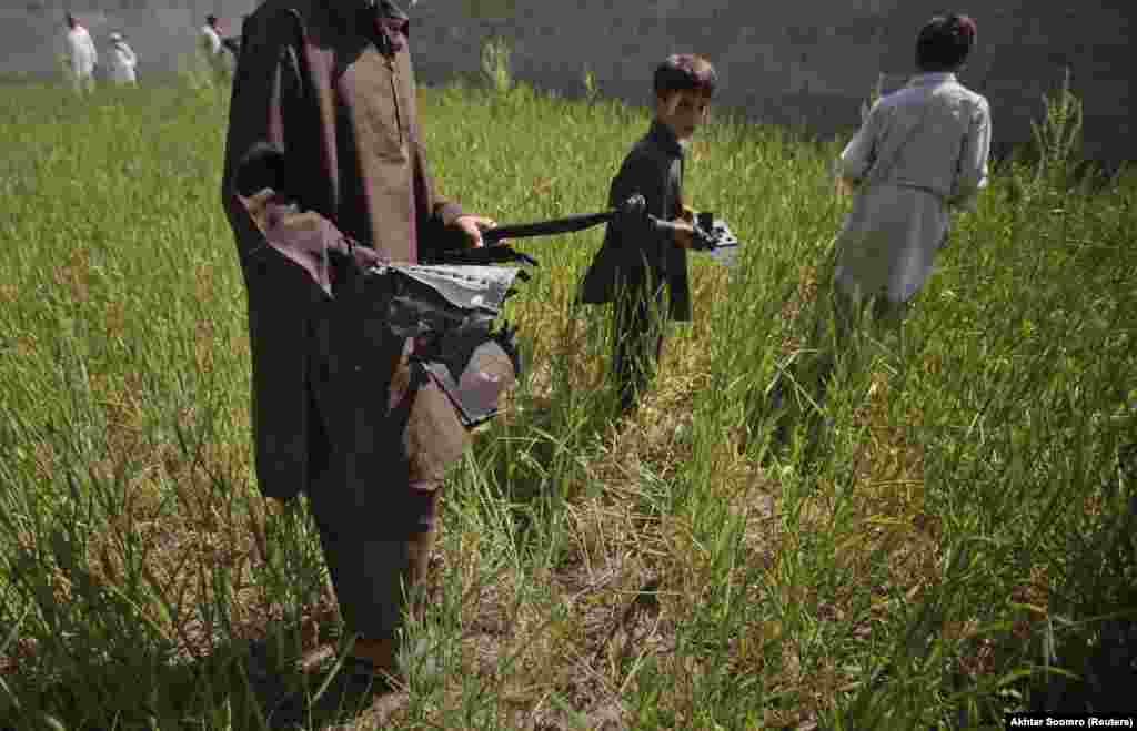 Local boys collect pieces from a U.S. helicopter one day after it was destroyed by the American commandos after crashing at bin Laden&#39;s compound. &nbsp; In 2020, Pakistani Prime Minister Imran Khan acknowledged probable &ldquo;linkages&rdquo; between his country&rsquo;s military and bin Laden when the Al-Qaeda leader was hiding in Pakistan, but denied any high-level ties existed.