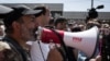 Armenian opposition leader Nikol Pashinian addresses supporters on the streets of Yerevan with a bullhorn on April 26.