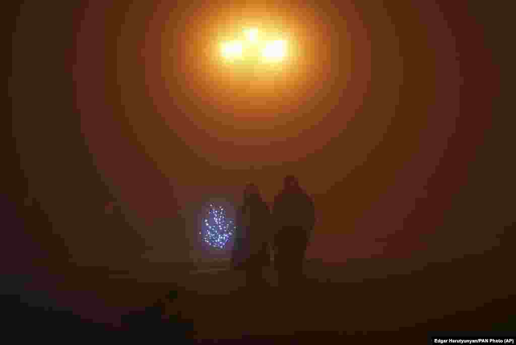 A couple walks in the fog in Stepanakert, the biggest city of Nagorno-Karabakh, a largely ethnic Armenian breakaway region of Azerbaijan, on December 15, 2022. This was at the beginning of the blockade in the Lachin Corridor, the only land connection between this area and Armenia. 