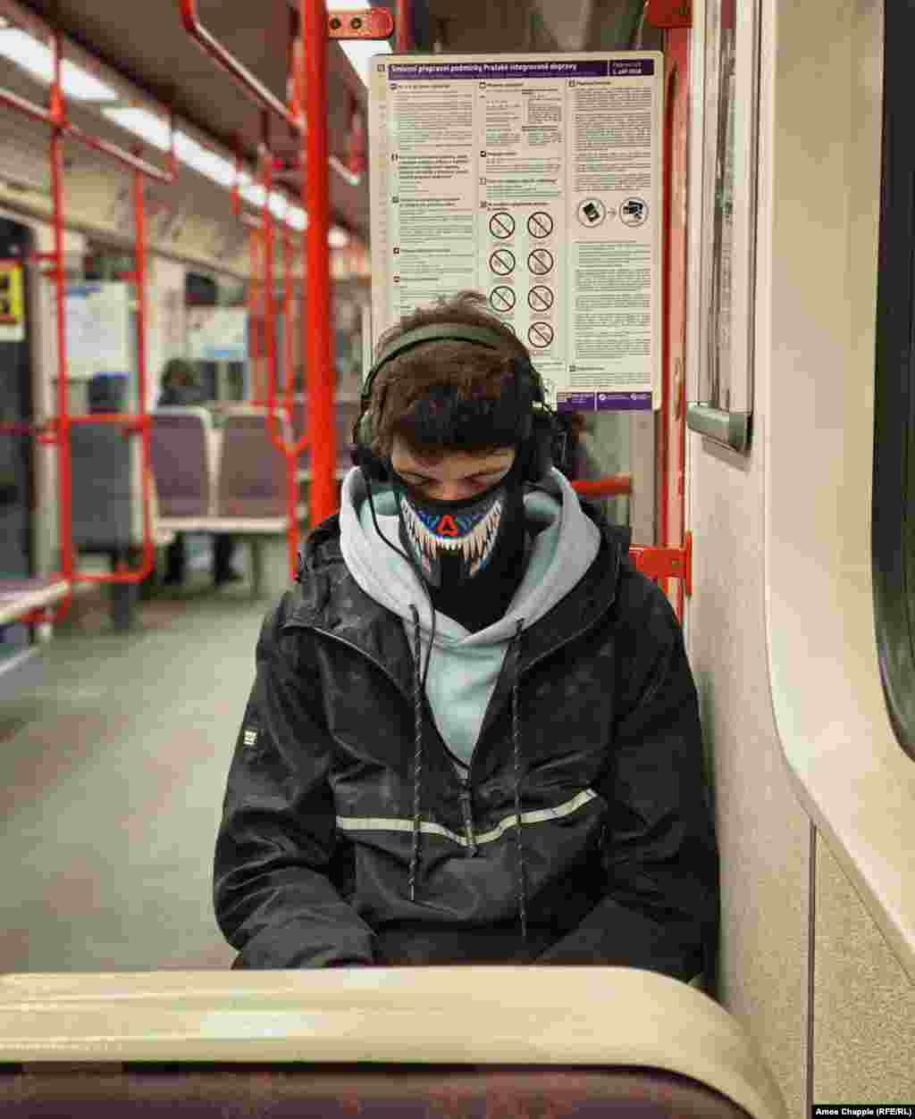 A man dozes in his face mask shortly before 8 a.m. on March 17. 