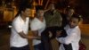 People carry an injured man near the Holey Artisan restaurant during an attack by gunmen in Dhaka's high-security diplomatic district on July 2.