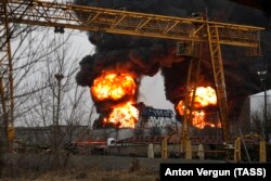 Smoke rises over a Belgorod oil depot hit by fire in April.