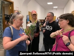 Chanysheva's husband, Almaz Gatin (third right), attends a court session in Moscow in July 2022.