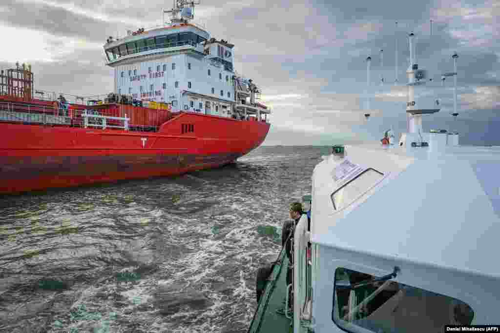 A cargo ship seen from a Romanian pilot vessel A pilot boat captain told AFP that since war broke out their workload navigating ships into the Sulina Canal "has increased a lot," adding, "we are hard at work from sunrise to sunset." A reported 400 boats passed through the Sulina Canal, last month, triple the traffic of May 2021. 