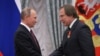 Russian President Vladimir Putin (left) bestows an award on St. Petersburg House of Music artistic director Sergei Roldugin during a ceremony at the Kremlin in Moscow in 2016.