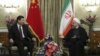Iranian President Hassan Rouhani (R) meets with Chinese President Xi Jinping in Tehran on January 23, 