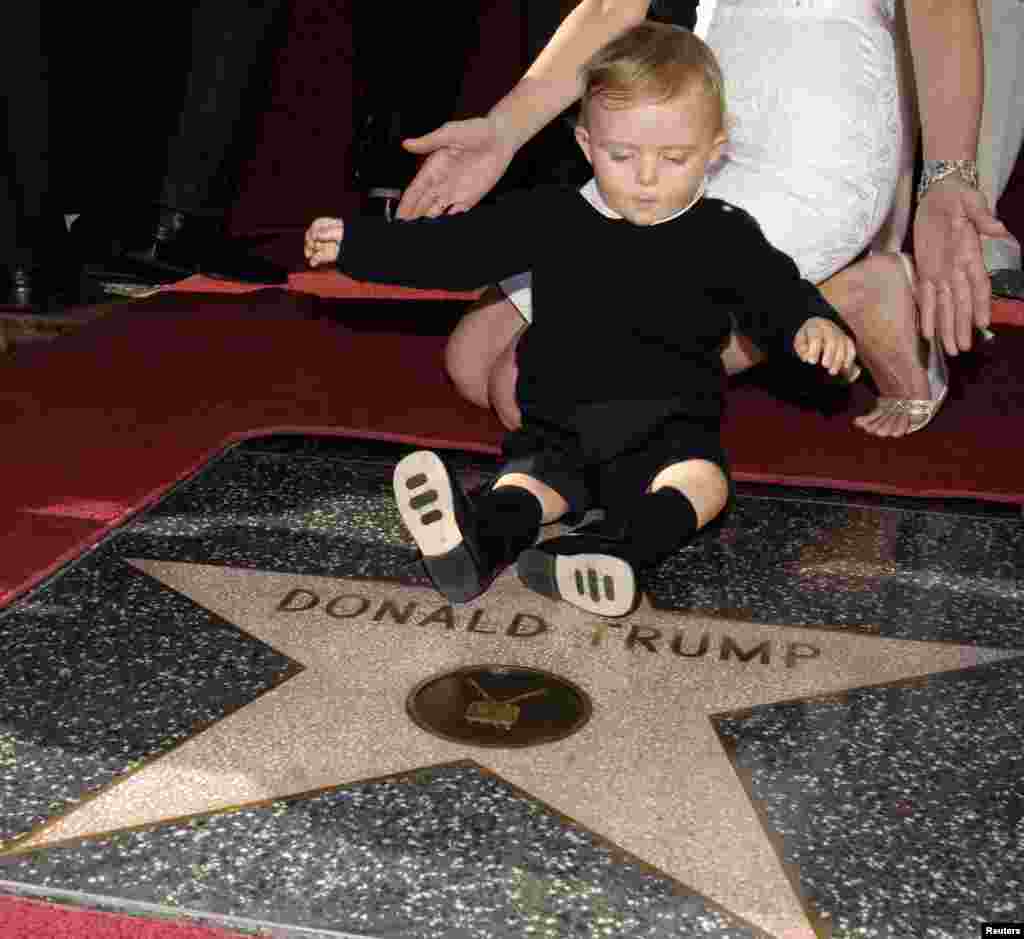 The couple's son Barron plays on his father's star on the Hollywood Walk of Fame in Los Angeles in 2007.