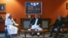 Former Afghan President Hamid Karzai (center) and former head of the Afghan reconciliation council, Abdullah Abdullah (right), meet with Qatari Foreign Minister Sheikh Mohammed bin Abdulrahman Al-Thani (left) on September 12.