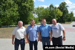 Beekeeper Andrei Malykhin (second right) and some similarly affected apiarists.