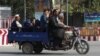 Residents leave Kunduz amid ongoing fighting between Taliban militants and Afghan security forces on October 5.