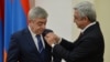 Armenia -- President Serzh Sarkisian (R) awards a medal to his brother Levon Sarkisian, 22 March, 2016.