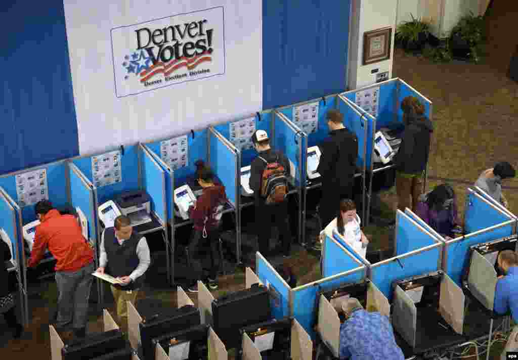  Local residents vote at a polling location in Denver, Colorado.