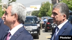 Armenia - President Serzh Sarkisian (L) and his chief bodyguard Vachagan Ghazarian (R), 11 July 2015.