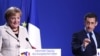 Angela Merkel și Nicolas Sarkozy la conferința de presă după summitul UE despre situația Greciei