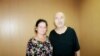 Aron Atabek (right) poses with human rights activist Yelena Semenova, who visited him in prison in Pavlodar in July 2019.