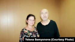 Aron Atabek (right) poses with human rights activist Yelena Semenova, who visited him in prison in Pavlodar in July 2019.