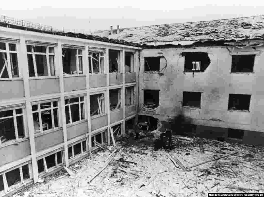 The scene of a bomb blast at RFE/RL's offices in Munich in February 1981.The effectiveness of RFE/RL was evidenced by multiple attacks on its staff and facilities. In 1981, a bombing reportedly paid for by Romania’s communist ruler, Nicolae Ceausescu, and arranged by Ilich Ramirez Sanchez, the notorious Venezuelan Marxist militant known as “Carlos the Jackal,” shattered a corner of RFE/RL’s Munich headquarters, injuring several staff inside. (Photo courtesy of Richard H. Cummings / RFE/RL)