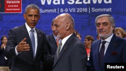 U.S. President Barack Obama (L) gestures next to Afghanistan's President Ashraf Ghani (C) and Afghanistan's Chief Executive Abdullah Abdullah at the NATO Summit in Warsaw, Poland on July 9.