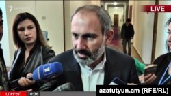 Opposition leader Nikol Pashinian talks to journalists in Yerevan on April 30.