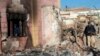 Police inspect the burned Hindu temple a day after a mob attack in a remote village in the Karak district, some 160 kilometers southeast of Peshawar, on December 31.