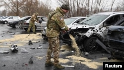 Russian military personnel take part in cleanup operations after what local authorities called a Ukrainian missile attack in Belgorod on March 17.