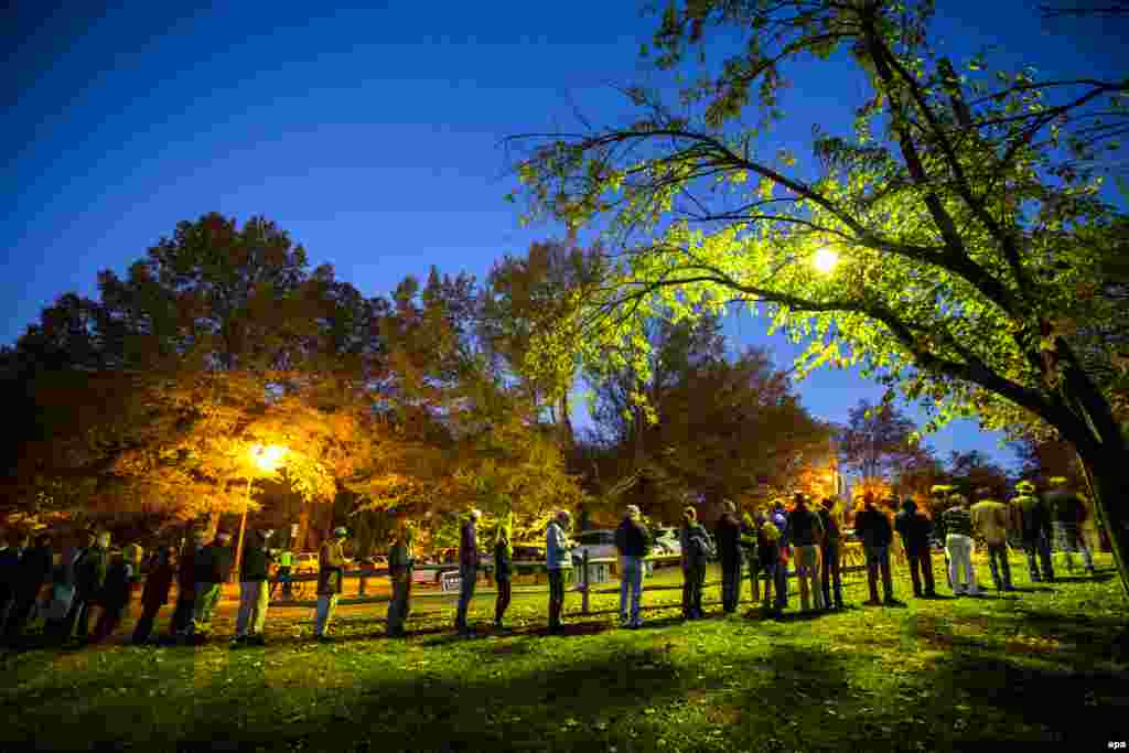 Virginia residents wait in line before the polls open at a historic property called the ''Hunter House'' in Vienna, Virginia.