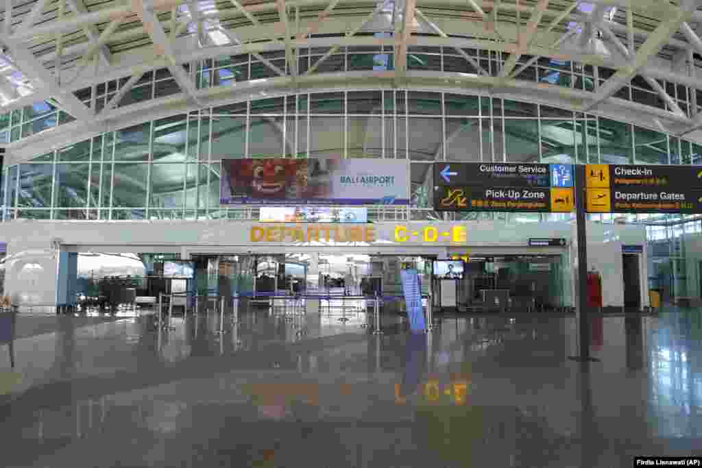 An empty departure terminal is seen in Bali, Indonesia, on April 24. Indonesia is suspending passenger flights and rail services as it restricts people in the world's most populous Muslim nation from traveling to their hometowns during the Islamic holy month of Ramadan because of the coronavirus outbreak.