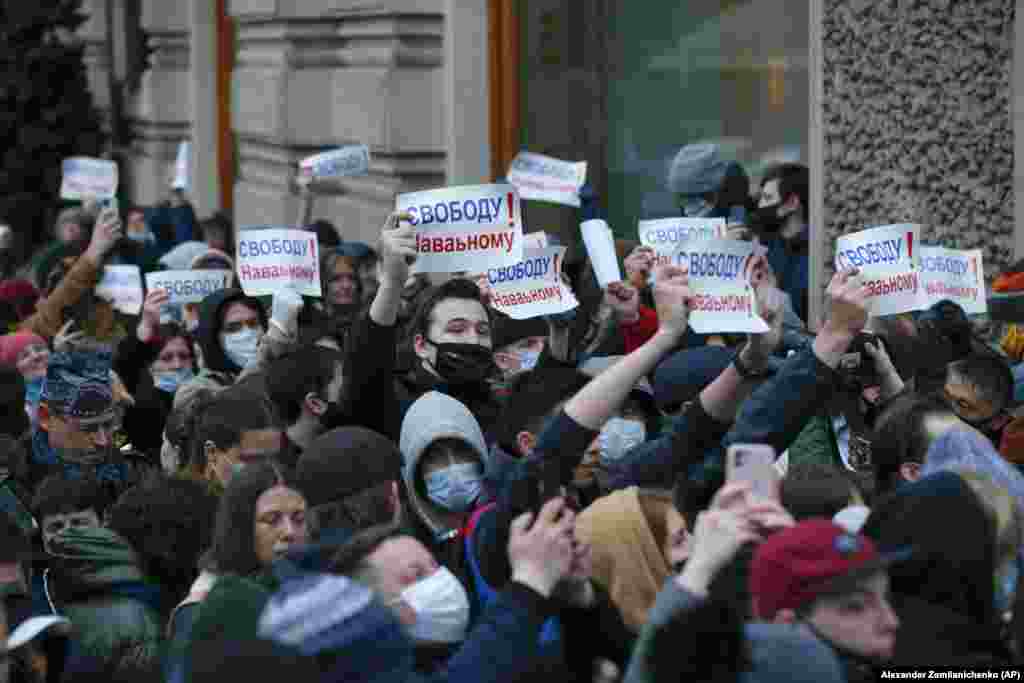 Protesters in Moscow march holding signs reading "Freedom for Navalny!" Navalny went on a hunger strike to demand doctors treat him for severe pain in his back and legs, and his health is reportedly deteriorating. 