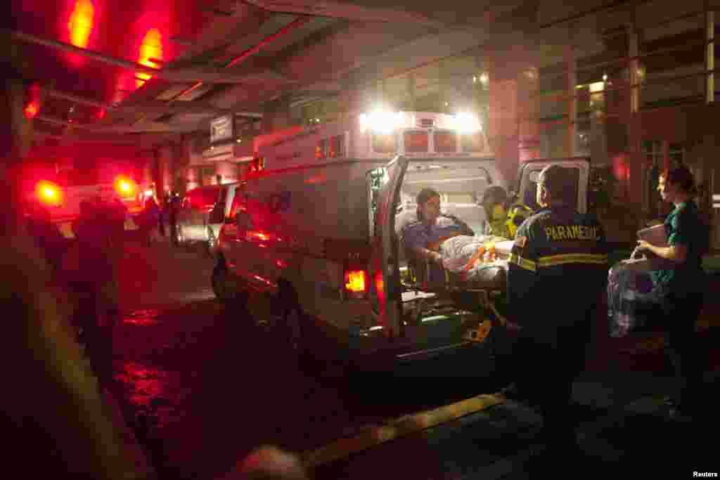 Paramedics evacuate patients from New York University's Tisch Hospital due to a power outage.