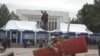 An anti-Kulov demonstrator packs his bags after an October rally