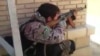 Afghan government forces, backed by Afghan special forces and U.S. air strikes, have been conducting clearing operations in and around the southern city of Lashkar Gah. (file photo)