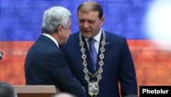 Taron Markarian (right) gave no explanation as to why he is stepping down.