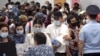 Uzbek migrant workers wait to check in for a flight to Tashkent at Tolmachevo Airport near Novosibirsk in 2020. Oson and Pay Way handle a large amount of remittances from Uzbeks living in Russia.