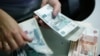 The announcement of new sanctions against Russia sparked a further downturn for the ruble, which has lost 13 percent of its value against the dollar this year.