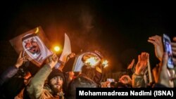 Protesters gather outside the Saudi Embassy in Tehran after the execution of a Shi'ite cleric by Riyadh.