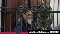 Azimjan Askarov appears in court in Bishkek in 2016.