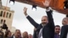 Armenian opposition leader Nikol Pashinian waves to supporters after being elected as prime minister in Yerevan's Republic Square on May 8, 2018.