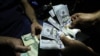 The U.S. dollar has reportedly been fetching up to 601,500 rials on Iran's unofficial currency-exchange market. (file photo)