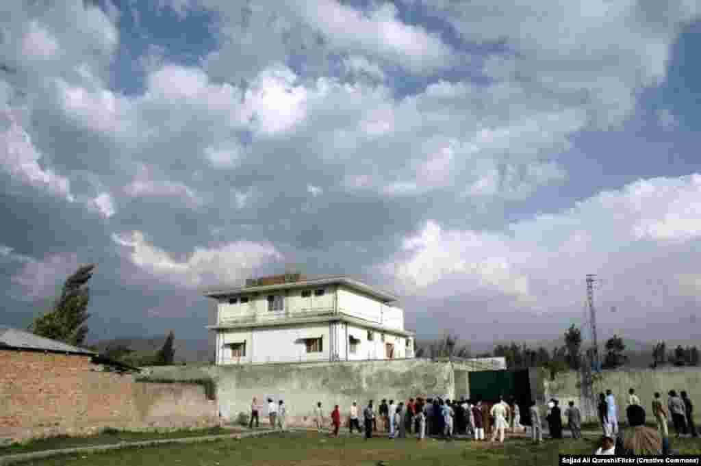 Locals gather around bin Laden&rsquo;s compound on May 4, 2011. &nbsp; The location of the compound, a short walk from a Pakistani military base, raised suspicion that the military had known about bin Laden&rsquo;s whereabouts. &nbsp;