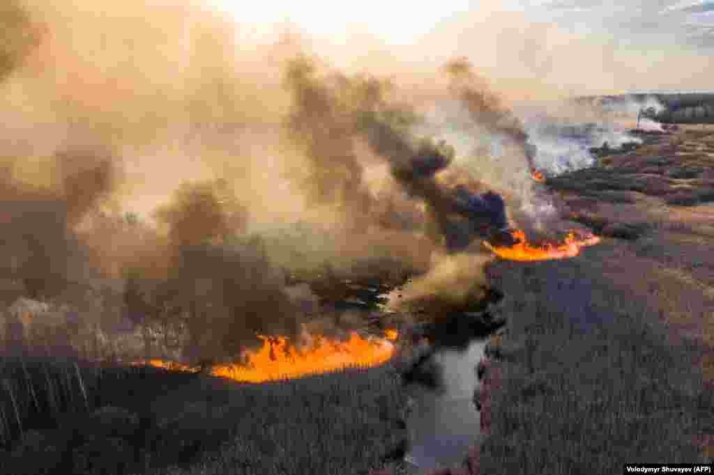 Wildfires burn in the 30-kilometer Chernobyl exclusion zone on April 10, not far from the defunct nuclear power plant. The acting director of Ukraine's State Ecology Inspection, Yehor Firsov, said on April 14 that firefighters had managed to finally extinguish the blaze.