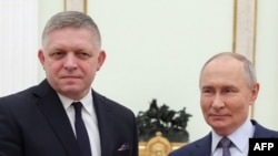 Russian President Vladimir Putin (right) and Slovak Prime Minister Robert Fico pose for a photo prior to talks in Moscow earlier this week.