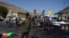 An Afghan protester scream near the scene of a suicide attack that targeted crowds of minority Shiite Hazaras during a demonstration at the Deh Mazang Circle in Kabul on July 23.